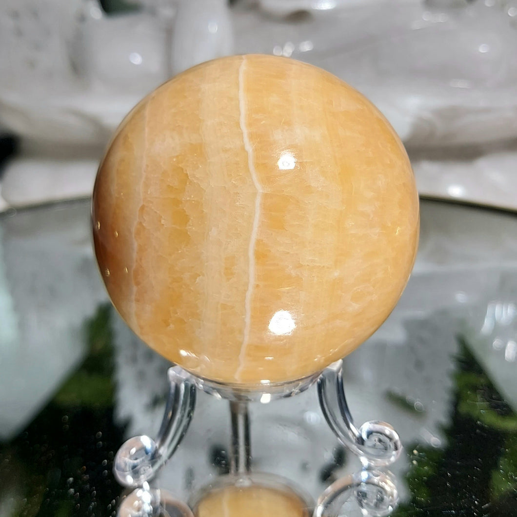 Orangencalcit Kugel mit Stand