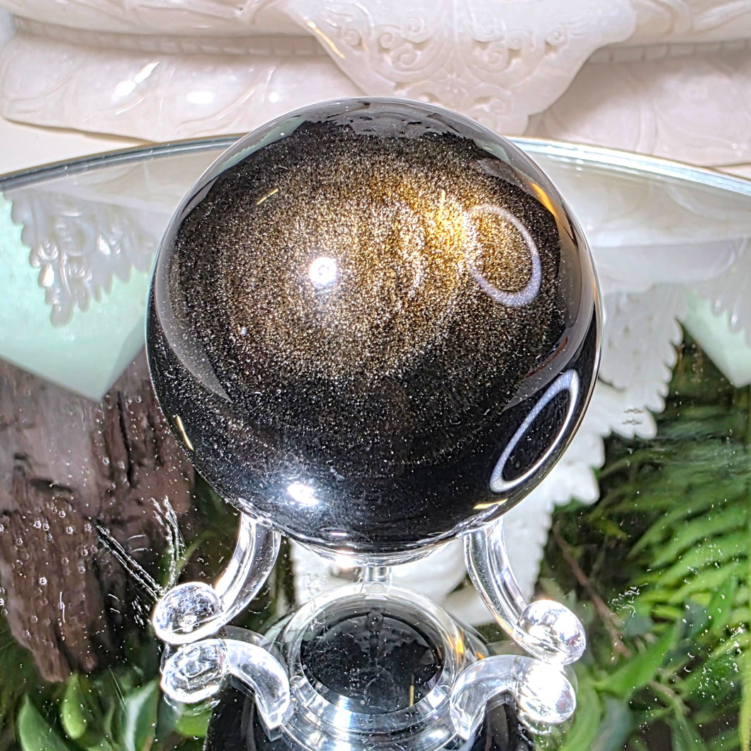 Obsidian Kugel mit goldenem Flash